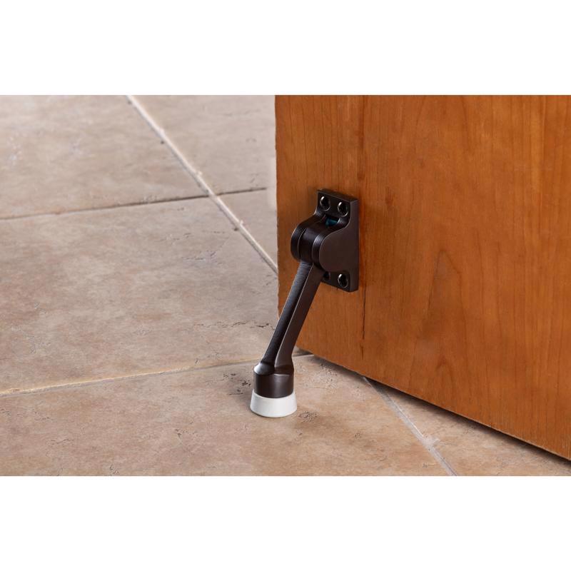 Brinks Brass Bronze Kick-Down Door Holder Mounts to door 1 in.